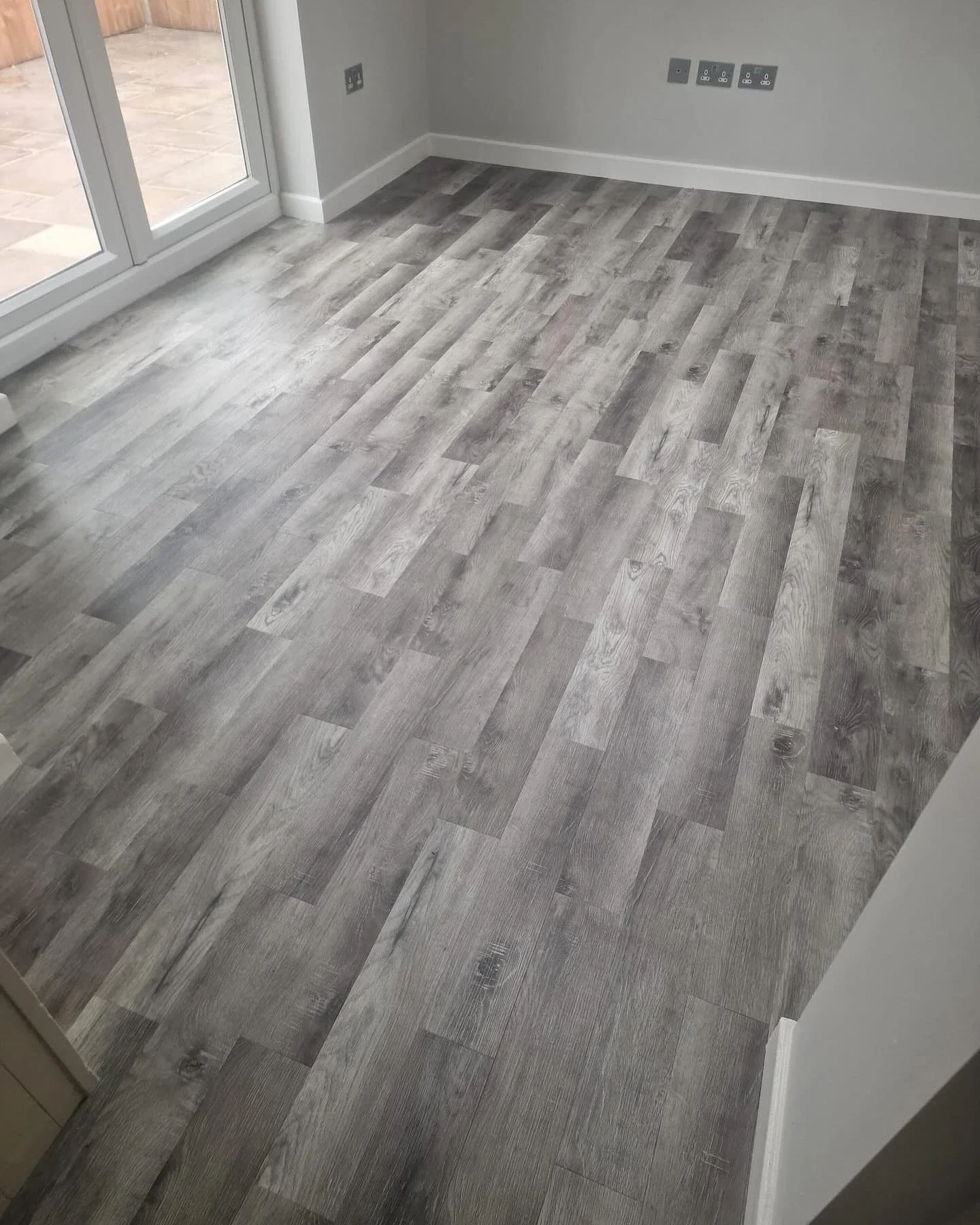 Pale wood-effect planks in a bright room