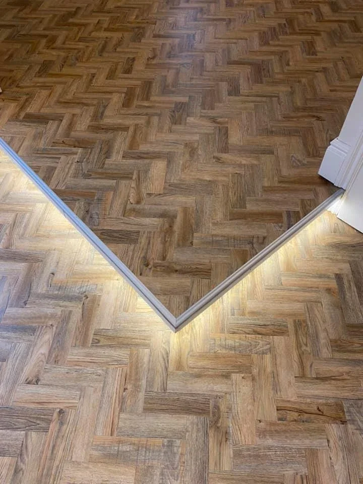 Herringbone flooring with a contrasting border detail