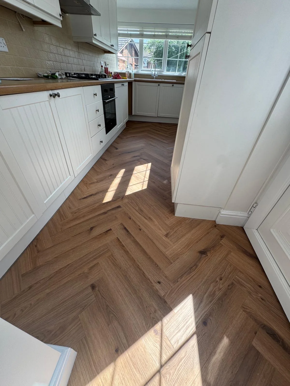 Herringbone flooring in a kitchen